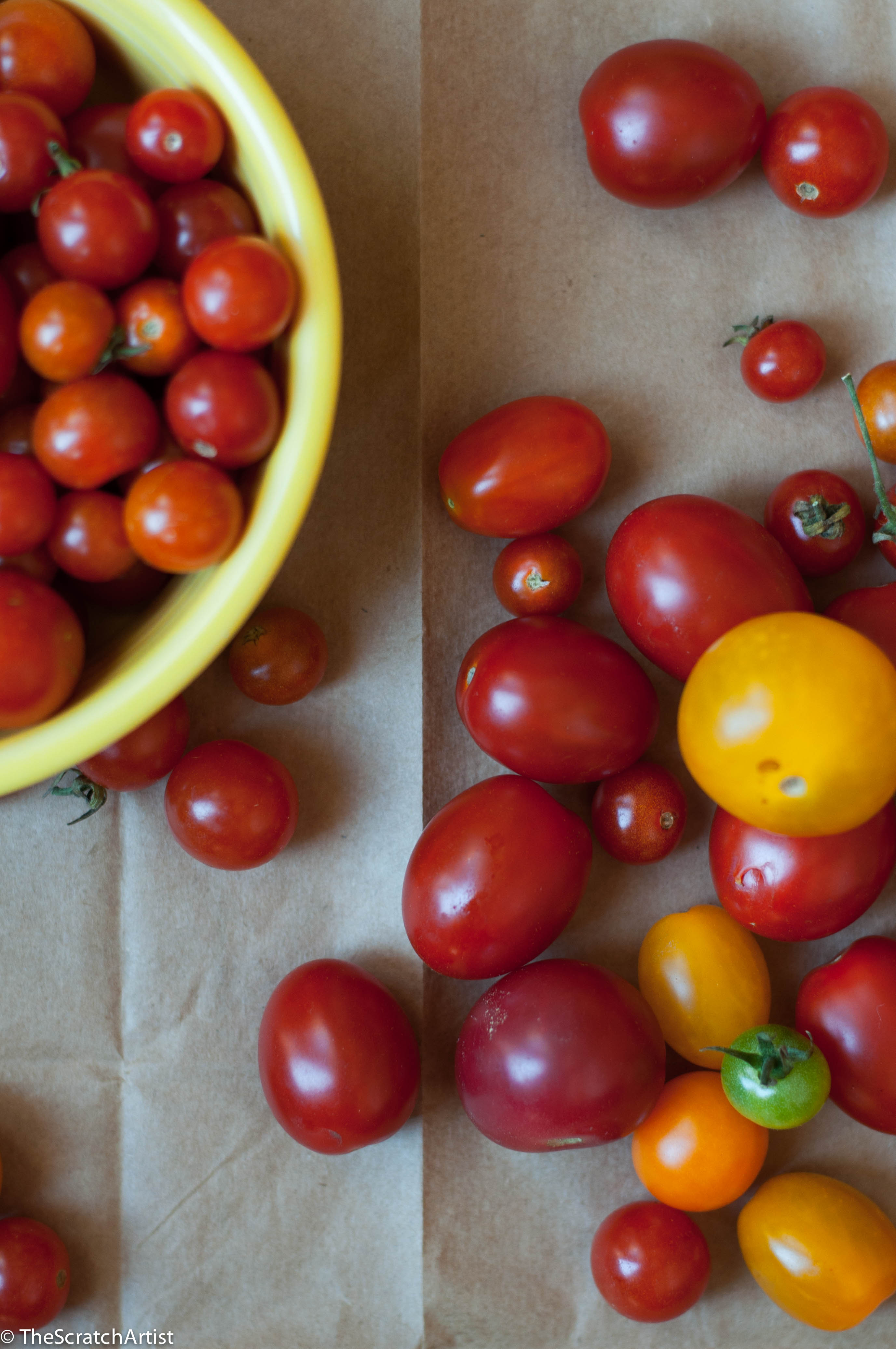 Have you all been swooning over these summer tomatoes as much as I have?  I'm not going to say there is nothing better than a perfect summer tomato, because you already know that, not to mention that phrase is overused and eye-roll-worthy.  And in reality, there really is nothing better than the perfect summer _____ (fill in any vegetable or fruit).  Walk into our kitchen and you'll see mounds of fruit peeking out over the tops of bowls, tomatoes rolling around the counters, vegetables jamming up our refrigerator drawers, and cutting boards dripping with freshly cut fruit and vegetable juice.  Oh it is so good!  Between our overflowing vegetable garden and the farmers market we are happy as clams.  Don't miss out on all of these fresh ingredients.  I have recently become really enthusiastic and inspired to eat seasonally.  I love my meals being dictated by what the earth is providing RIGHT NOW.  It has been a real shift in thinking about food and meal planning and much more enjoyable.  It is like like the childhood experience of christmas over and over agin.  What do we get to make today?  In addition to all this, it is such a joy participating in the community of farmers and local entrepreneurs.  It is all just so wonderful.  So get out there and get some if you haven't found your way to your local farmstead/market.  I don't like complication.  I like simplicity and letting things be what they are.  Both with food and people.  In my kitchen you are not going to find fancy sauces or dishes with long ingredient lists.  This is especially true in the summer when I want the pure taste of what I've harvested to sing out at its purest.  See also my beans on toast post for simple eating with fresh ingredients.  This ode to tomatoes is a nod to simplicity and letting great ingredients take over your senses.  I questioned whether to share this recipe, because it is not really a recipe, but I find minimal inspiring.  Hopefully you all do too.  And these tomatoes!  This is my lunch for the next 6-7 weeks.  Get out there and get your tomato on!