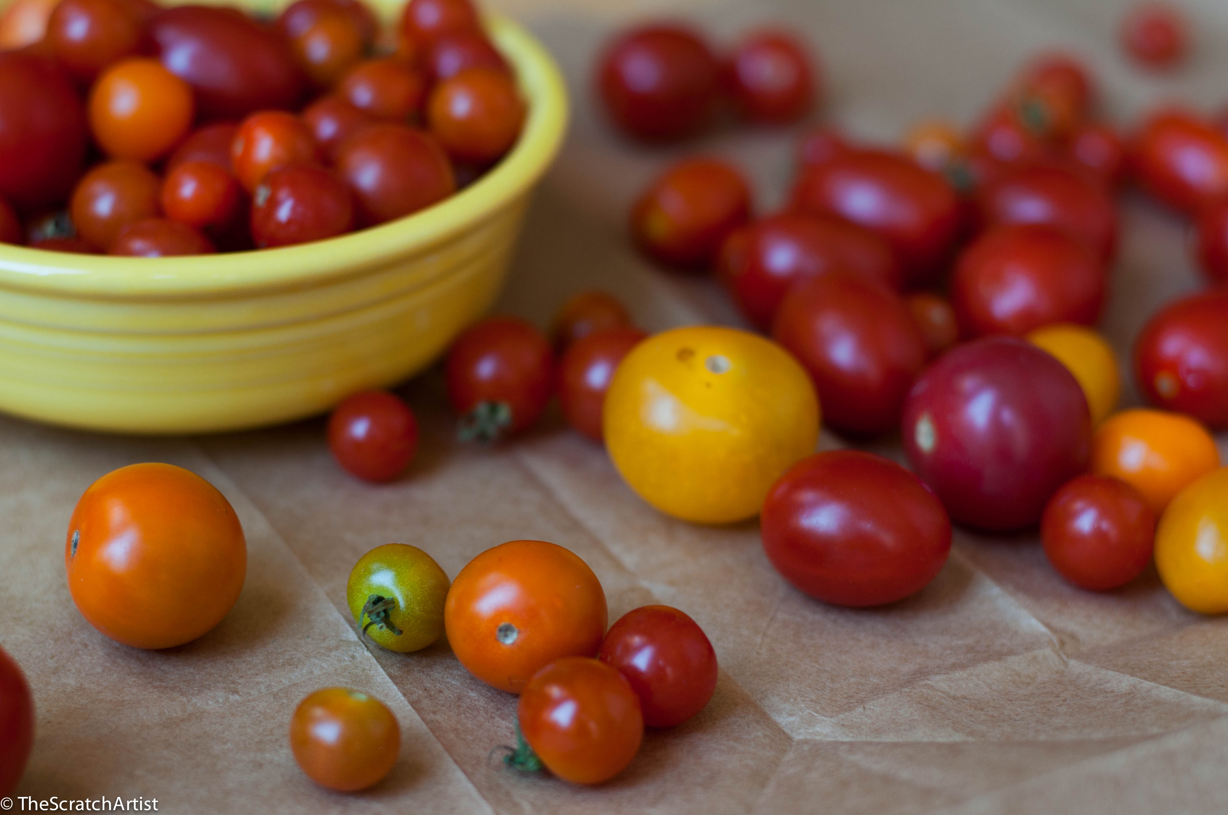 Have you all been swooning over these summer tomatoes as much as I have?  I'm not going to say there is nothing better than a perfect summer tomato, because you already know that, not to mention that phrase is overused and eye-roll-worthy.  And in reality, there really is nothing better than the perfect summer _____ (fill in any vegetable or fruit).  Walk into our kitchen and you'll see mounds of fruit peeking out over the tops of bowls, tomatoes rolling around the counters, vegetables jamming up our refrigerator drawers, and cutting boards dripping with freshly cut fruit and vegetable juice.  Oh it is so good!  Between our overflowing vegetable garden and the farmers market we are happy as clams.  Don't miss out on all of these fresh ingredients.  I have recently become really enthusiastic and inspired to eat seasonally.  I love my meals being dictated by what the earth is providing RIGHT NOW.  It has been a real shift in thinking about food and meal planning and much more enjoyable.  It is like like the childhood experience of christmas over and over agin.  What do we get to make today?  In addition to all this, it is such a joy participating in the community of farmers and local entrepreneurs.  It is all just so wonderful.  So get out there and get some if you haven't found your way to your local farmstead/market.  I don't like complication.  I like simplicity and letting things be what they are.  Both with food and people.  In my kitchen you are not going to find fancy sauces or dishes with long ingredient lists.  This is especially true in the summer when I want the pure taste of what I've harvested to sing out at its purest.  See also my beans on toast post for simple eating with fresh ingredients.  This ode to tomatoes is a nod to simplicity and letting great ingredients take over your senses.  I questioned whether to share this recipe, because it is not really a recipe, but I find minimal inspiring.  Hopefully you all do too.  And these tomatoes!  This is my lunch for the next 6-7 weeks.  Get out there and get your tomato on!